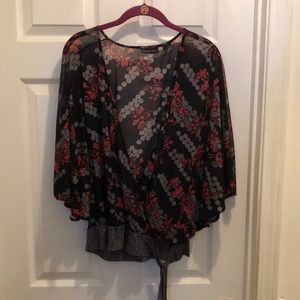 100% Nylon sheer top. Size XL Red white and black design